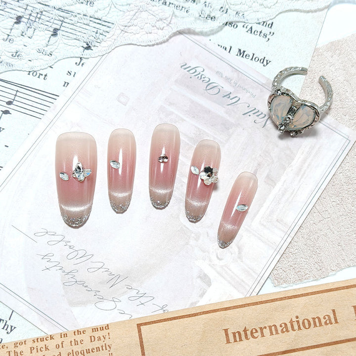 Glamorous artificial nails with glitter decorations Kalsten