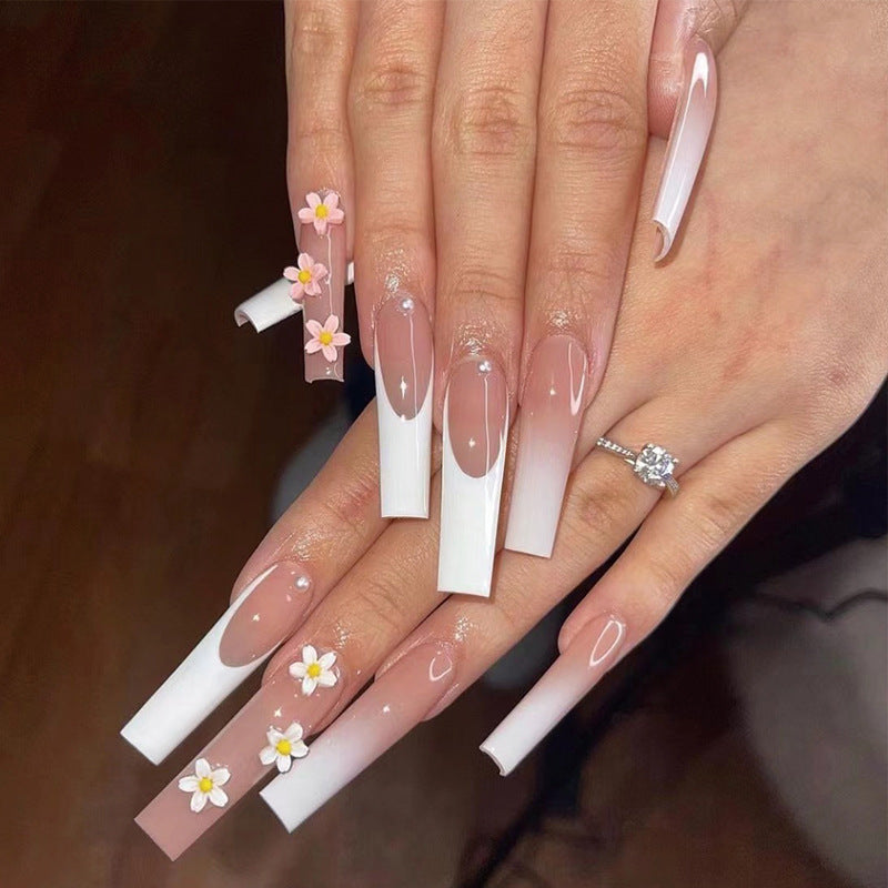 Artful nail extensions with elegant gradient and creative floral accents Kalsten