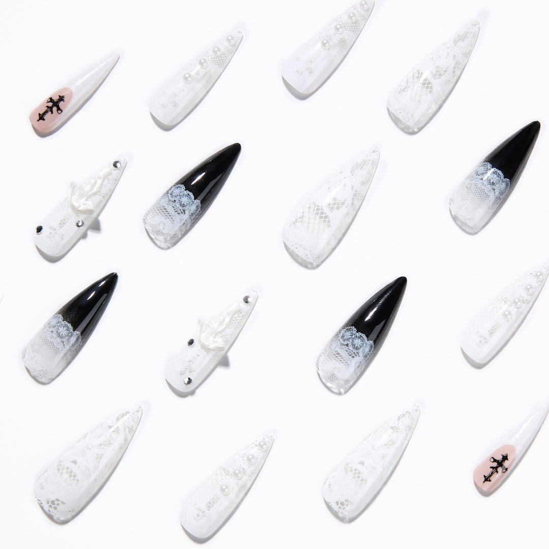 Artful stiletto nails with unique 3D elements and glitter accents Kalsten