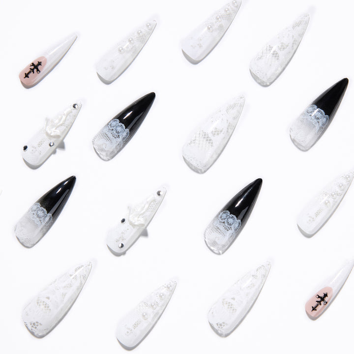 Artful stiletto nails with unique 3D elements and glitter accents Kalsten