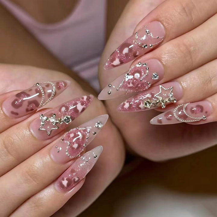 Artistic stiletto nails with glitter and jewelry accents Kalsten