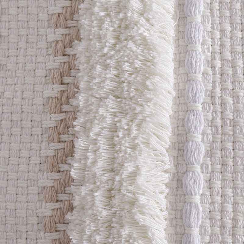 Structured living room carpet with 3D tufting and geometric diamond relief