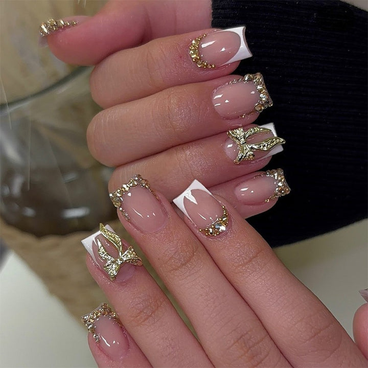 Artificial nail set with floral design and glamorous embellishments Kalsten