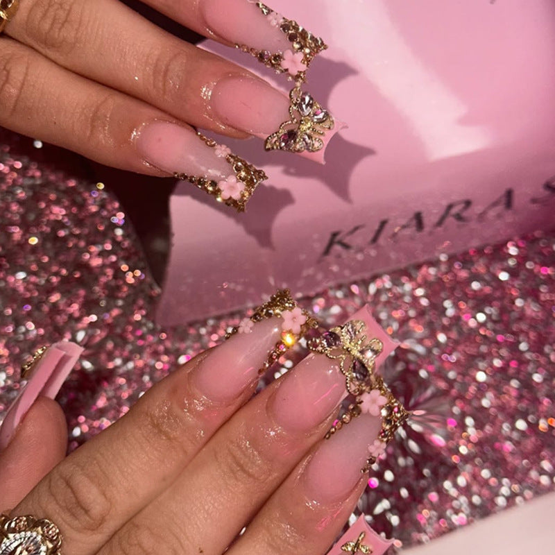 Artificial nail extension with glamorous embellishments Kalsten