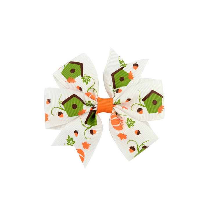 Halloween bow with pumpkin and witch motifs
