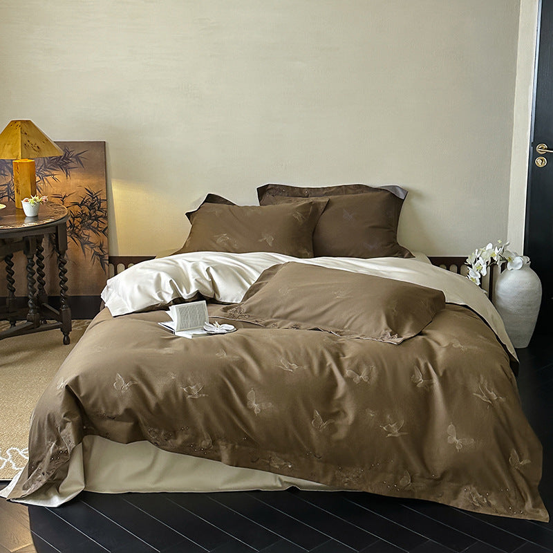 Elegant finely woven bedding set made of Mako satin with subtle butterfly jacquard structure and reversible pillowcase