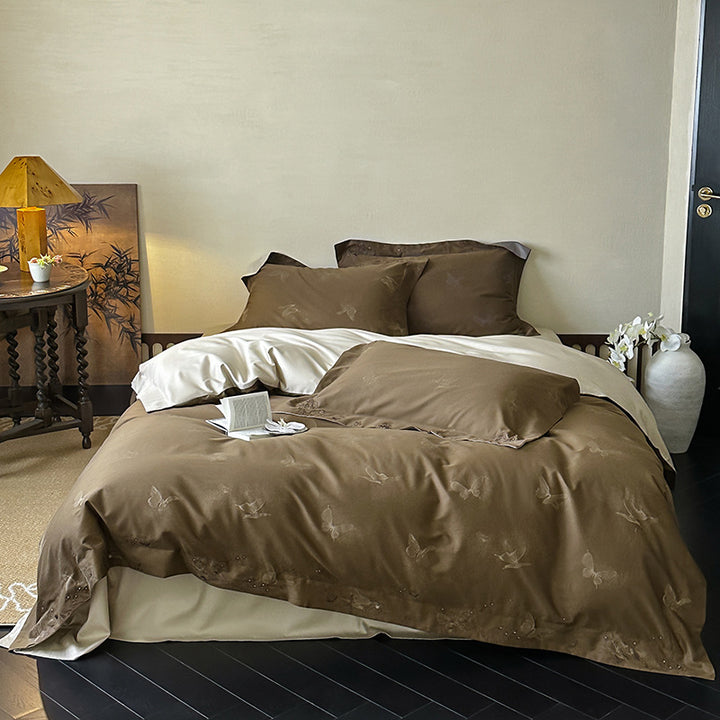 Elegant finely woven bedding set made of Mako satin with subtle butterfly jacquard structure and reversible pillowcase