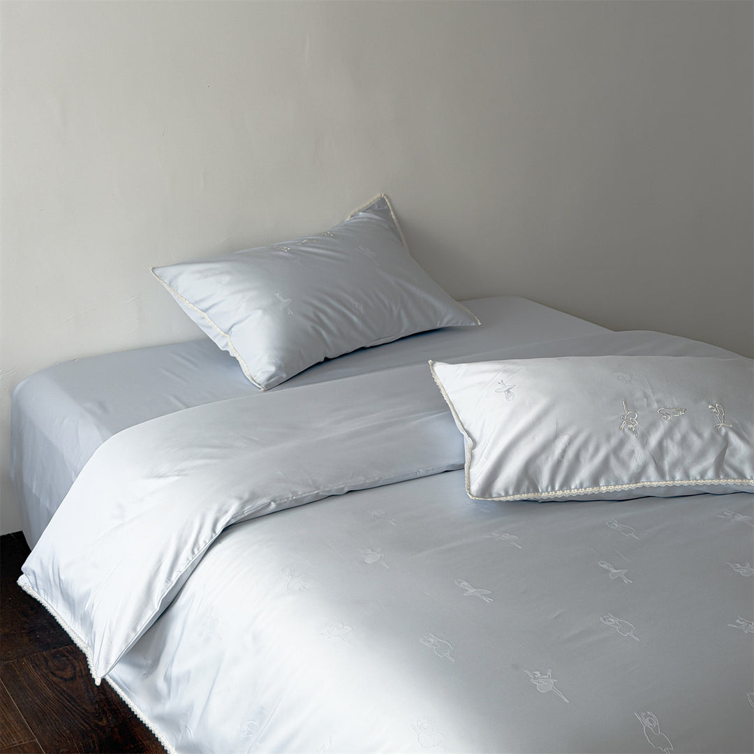 High-quality bed set made of cotton satin with subtle ballerina relief embroideries & lace edging