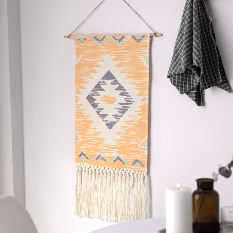 Woven Boho wall tapestry in Ethno design with long fringes and wood stick Kalsten