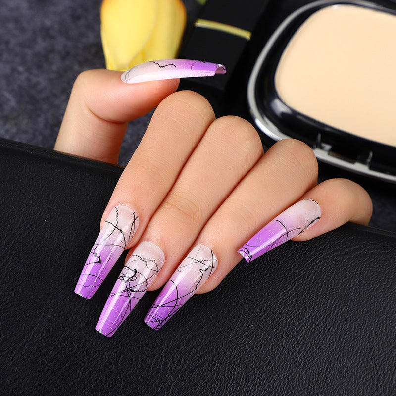 Artificial nails in modern ombre design with marbled accents Kalsten