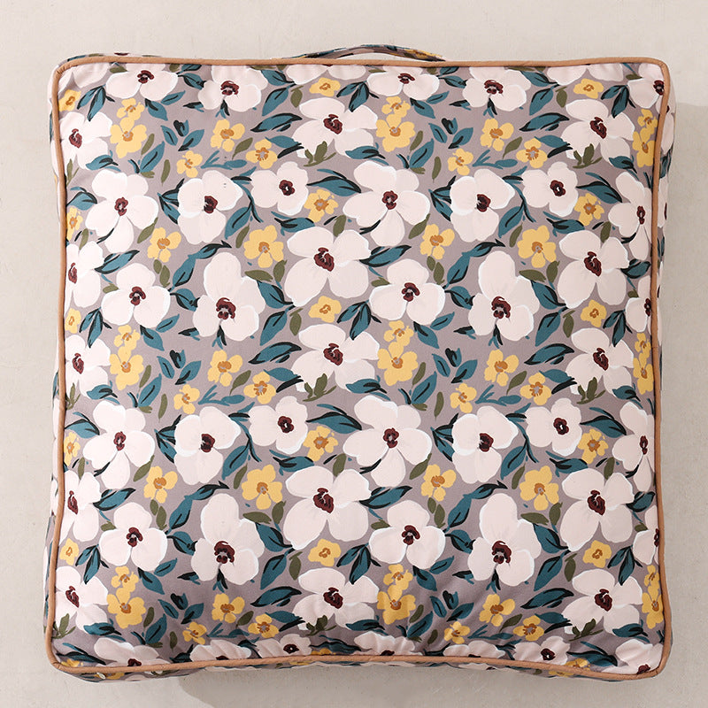 Large square floor cushion with floral cotton cover, piping, and carrying handle Kalsten