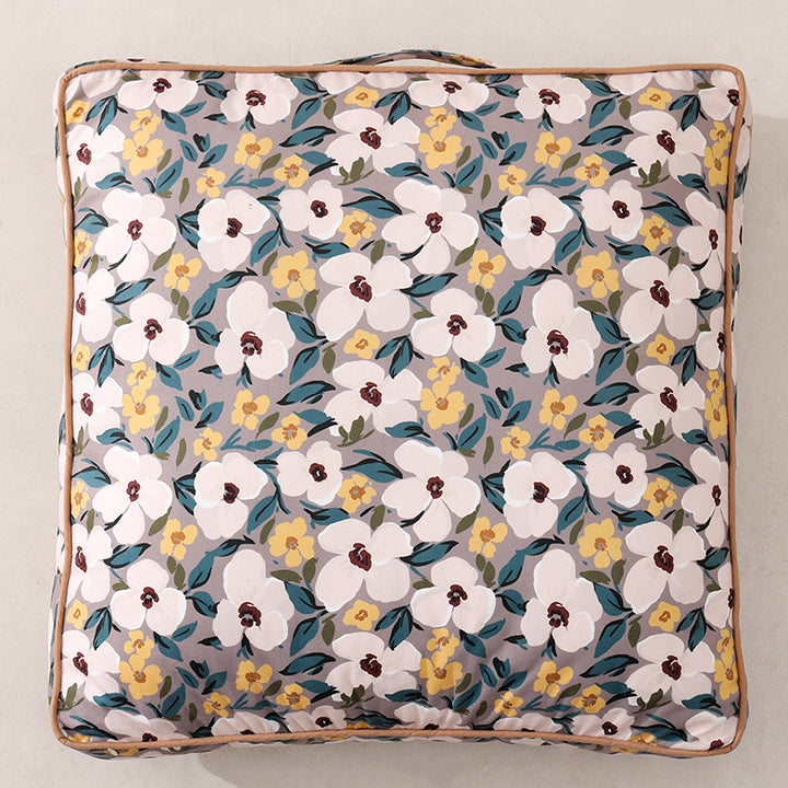 Large square floor cushion with floral cotton cover, piping, and carrying handle Kalsten
