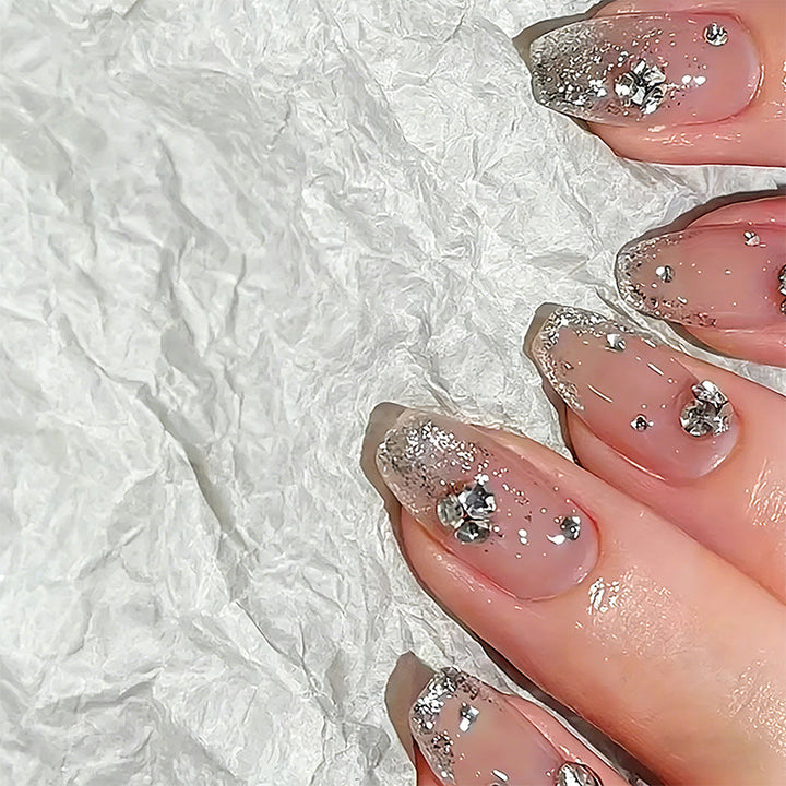 Acrylic nail set with extravagant glitter and crystal embellishments Kalsten