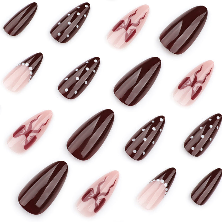 Elegantly designed stiletto nails with artistic accents Kalsten