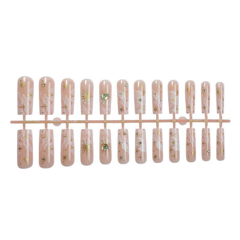 Nail set with glamorous gold decorations Kalsten