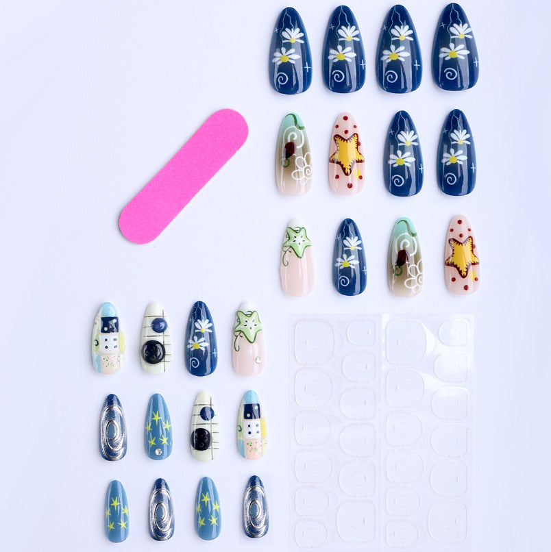 Artificial nails with creative maritime designs and 3D elements Kalsten