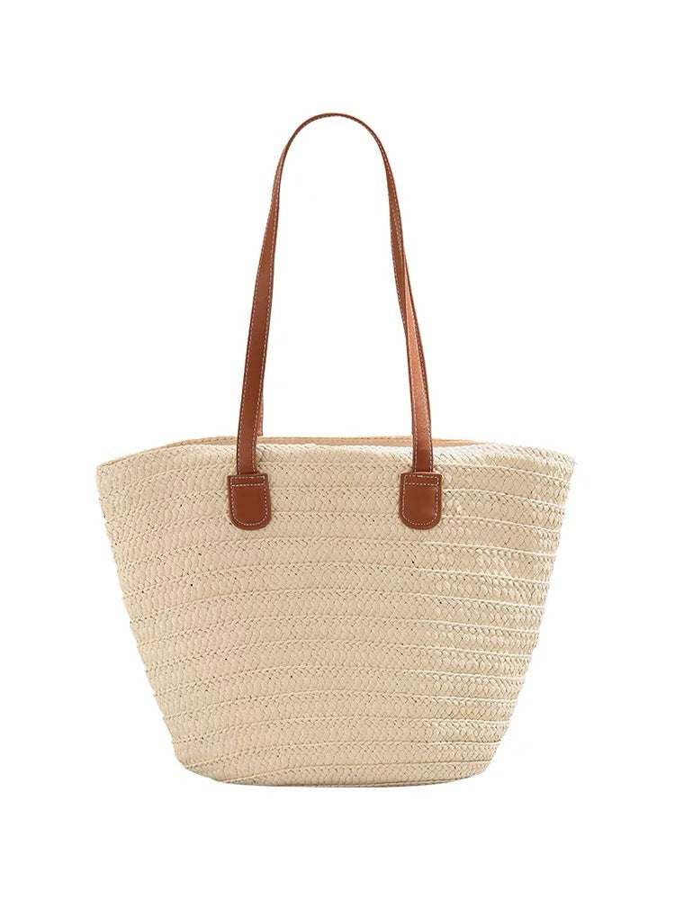 Stylish beach bag made of woven natural material with leather handles Kalsten
