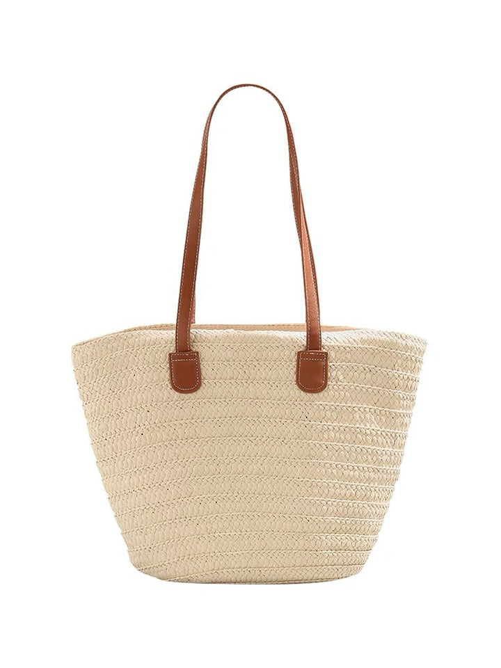 Stylish beach bag made of woven natural material with leather handles Kalsten