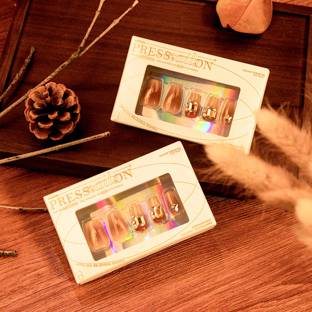 Artificial nail art with elegant jewelry accents Kalsten