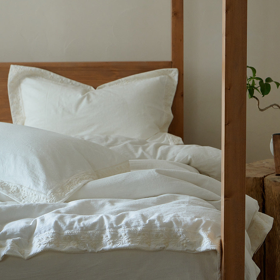 Cotton gauze bedding set with fine tone-on-tone floral embroidery and ruffle