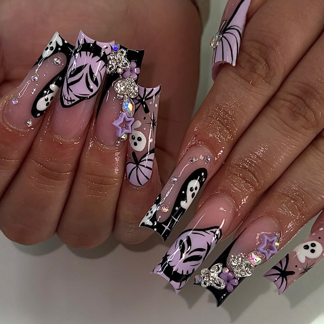 Artificail nails with creative Halloween design and glitter accents Kalsten