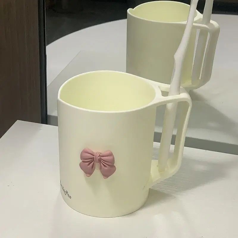 Ceramic mug with elegant bow motif Kalsten