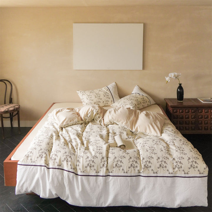 Cotton bedding set with waffle structure, fine floral print and decorative ribbon