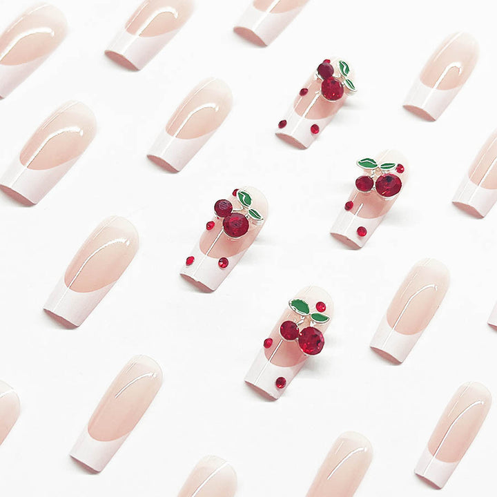 Acrylic nail set with chic cherry motifs and elegant French tip Kalsten