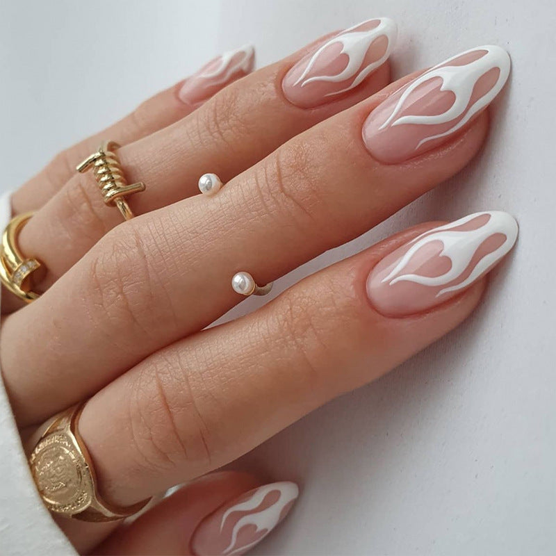 Artful stiletto nails with heart-shaped accents Kalsten