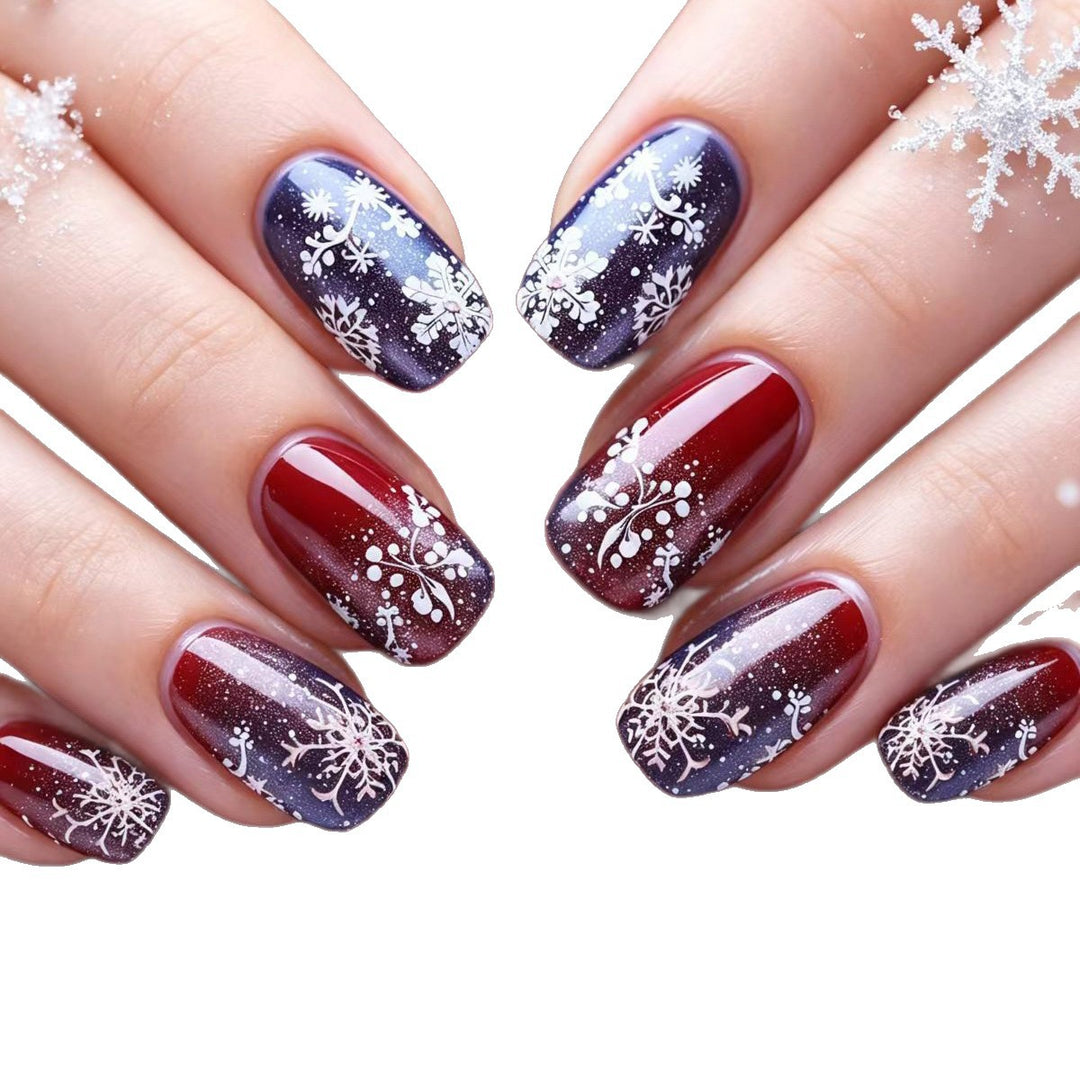 Artificial nails with festive glitter effect and wintry snow motif Kalsten