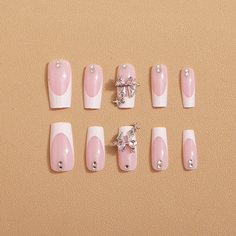 Artificial nail set with luxurious French tips and elegant embellishments Kalsten