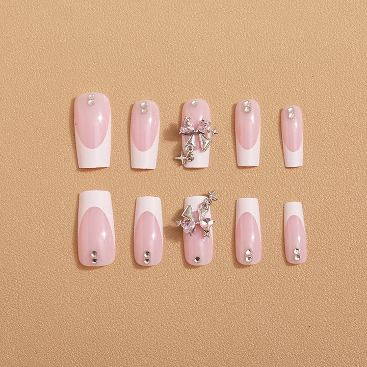 Artificial nail set with luxurious French tips and elegant embellishments Kalsten