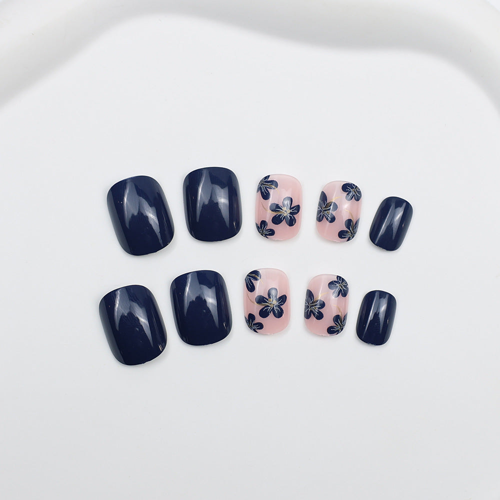 Artificial nails with floral designs and glossy accents Kalsten