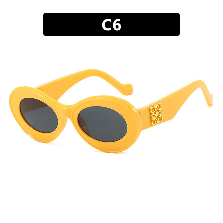 Women's fashionable sunglasses with oval frame and golden accents Kalsten