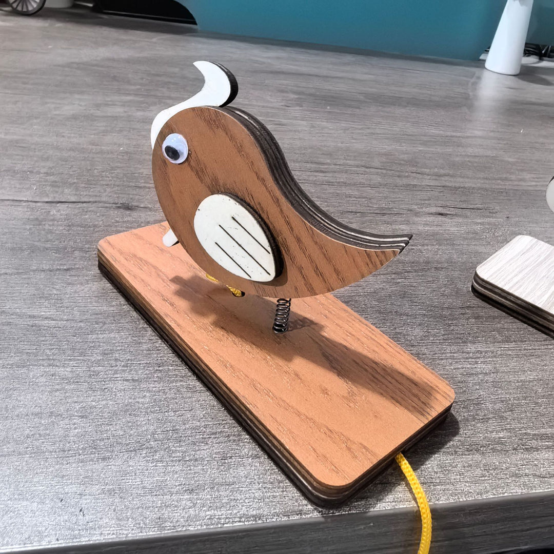 Unisex nan movable wooden bird table figure made of plywood with spiral spring and pull line Kalsten