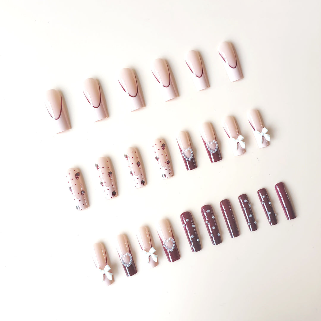 Artificial artificial nails with heart designs and holographic accents Kalsten