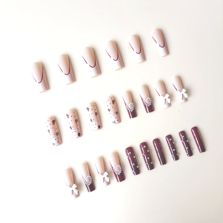Artificial artificial nails with heart designs and holographic accents Kalsten