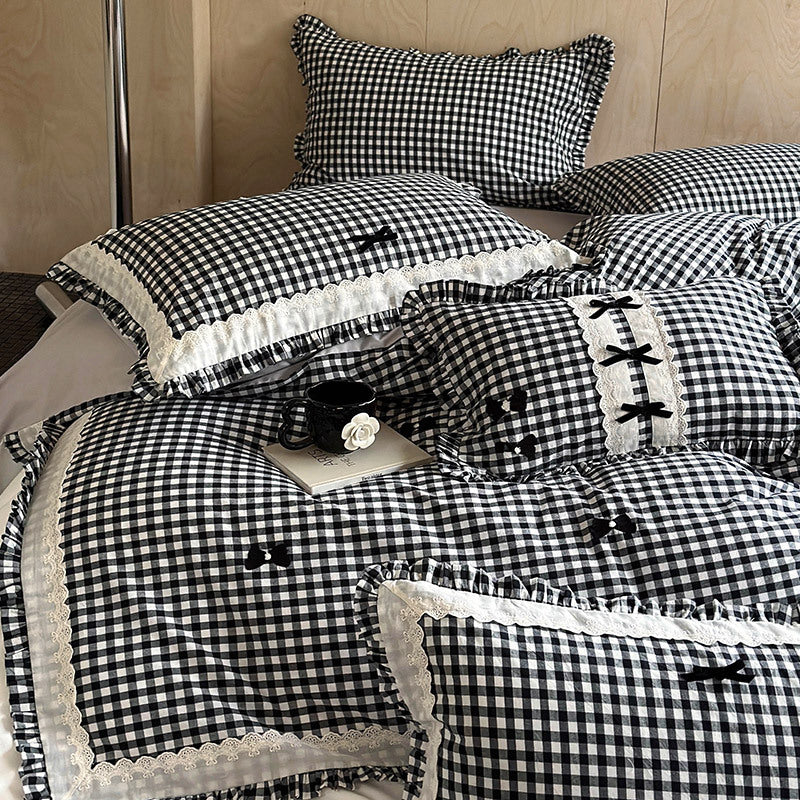 Bedding set in country house style with Vichy check, ruffle and embroidery appliqués