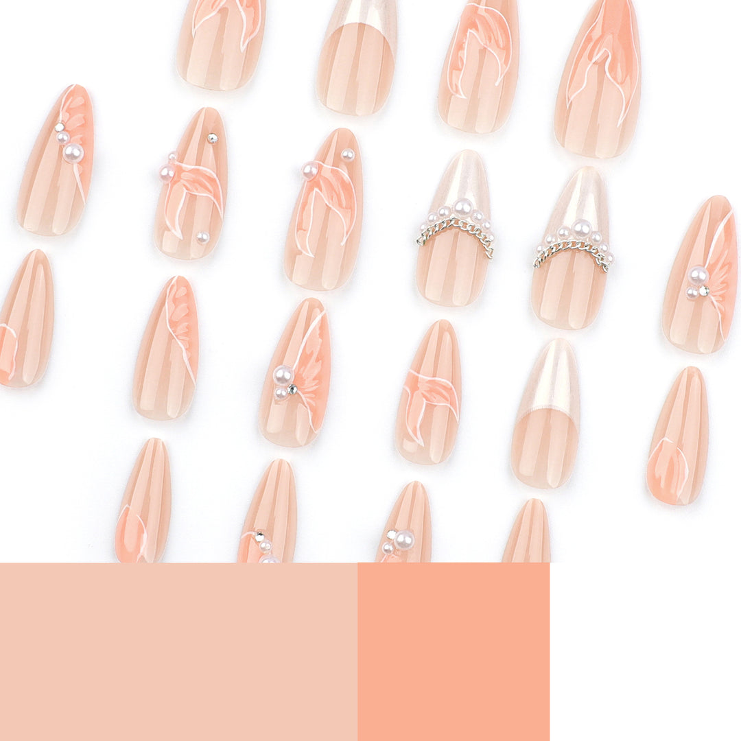 Artistic stiletto nails with pearl and flower embellishments Kalsten