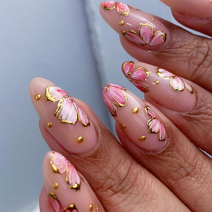 Artificial nails with graceful floral patterns and golden accents Kalsten