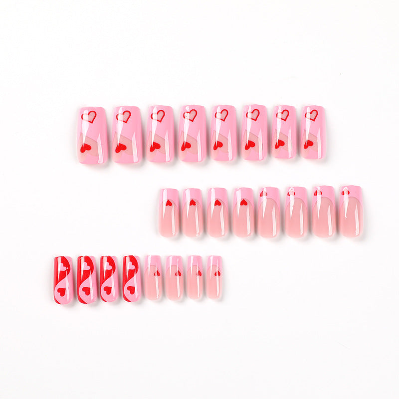 Artificial nail art with heart design and glitter accents Kalsten