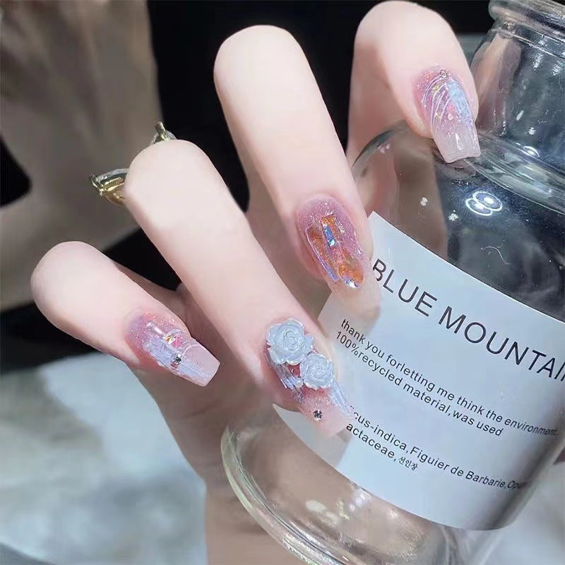Artistic nail art with floral embellishments Kalsten