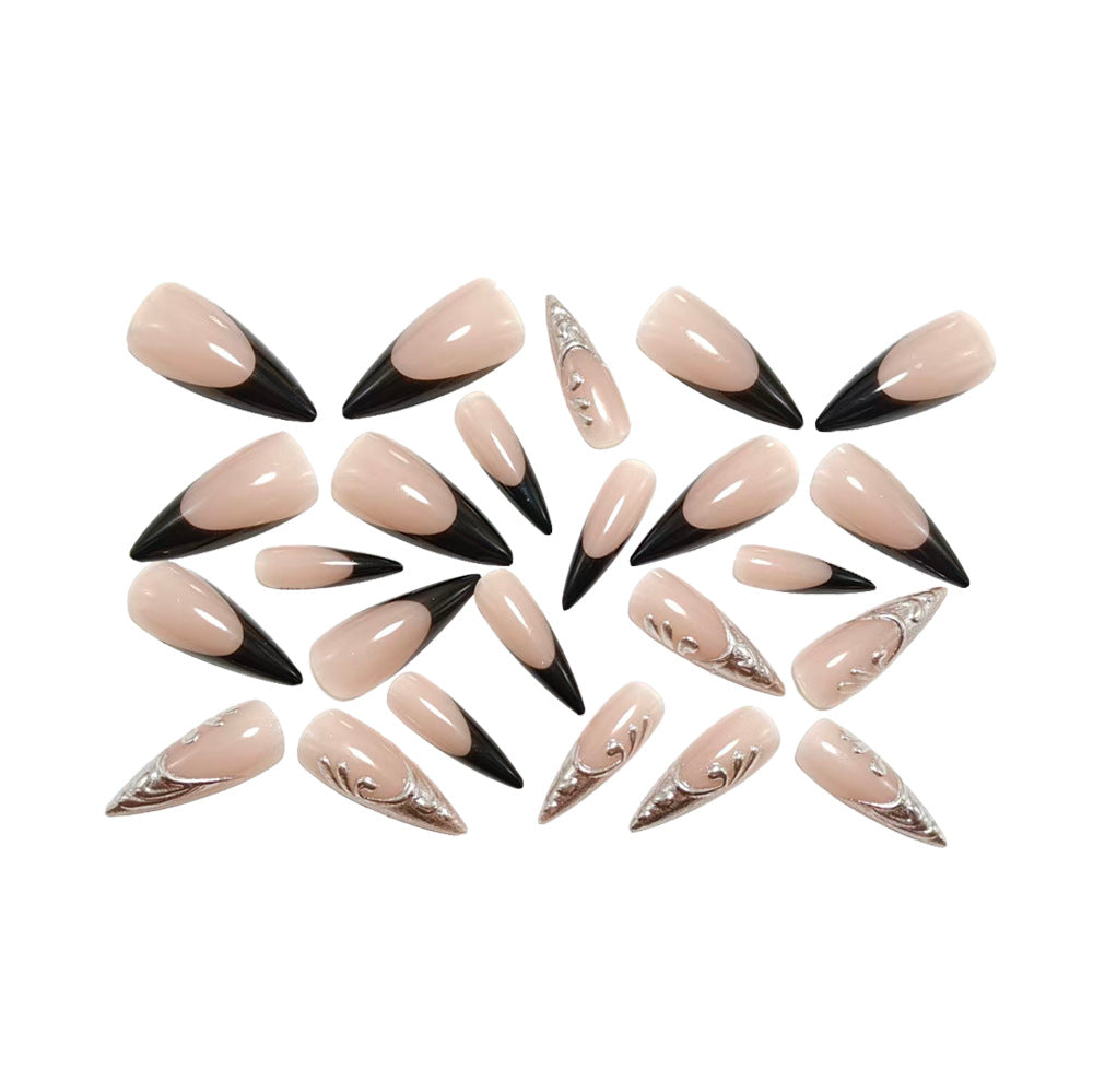 Artificial nails in elegant stiletto style with elaborate metal decoration Kalsten