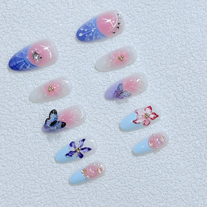 Artful Nail Art with Floral Details and Butterflies Kalsten