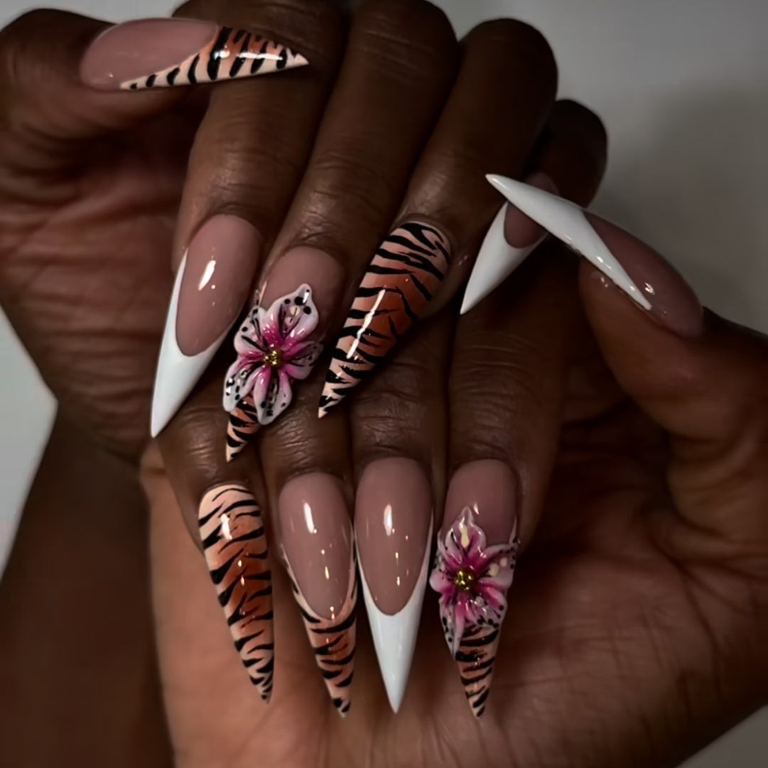 Artful stiletto nails with floral and animal design Kalsten