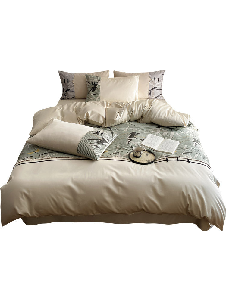 Reversible satin bedding set with quilted décor and botanical bamboo print