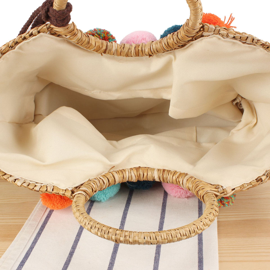Straw handbag with colorful tassels and pom poms Kalsten