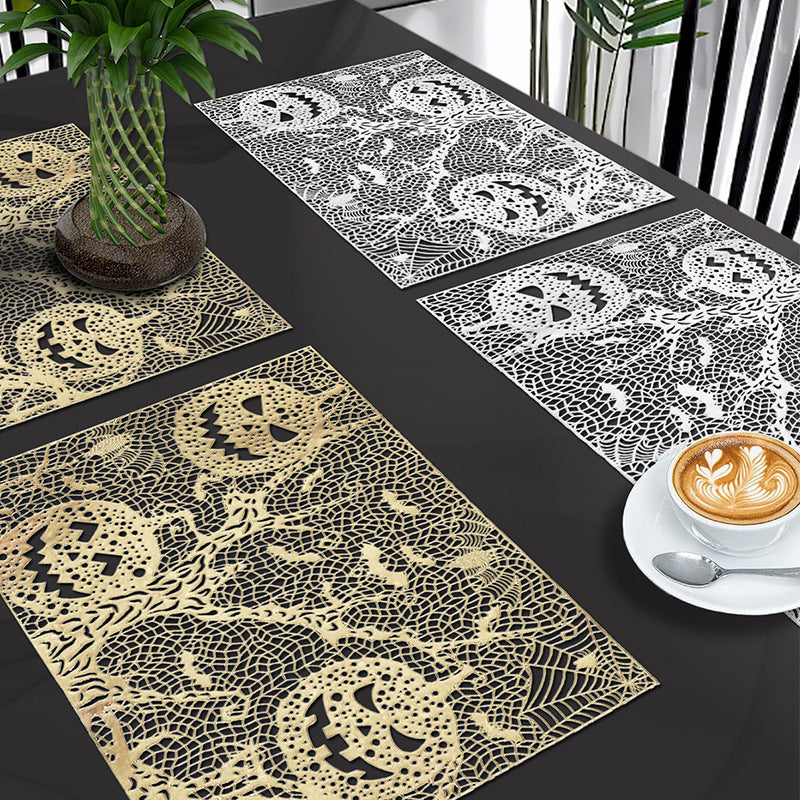 Halloween plastic table mats with intricate pumpkin and spider web design