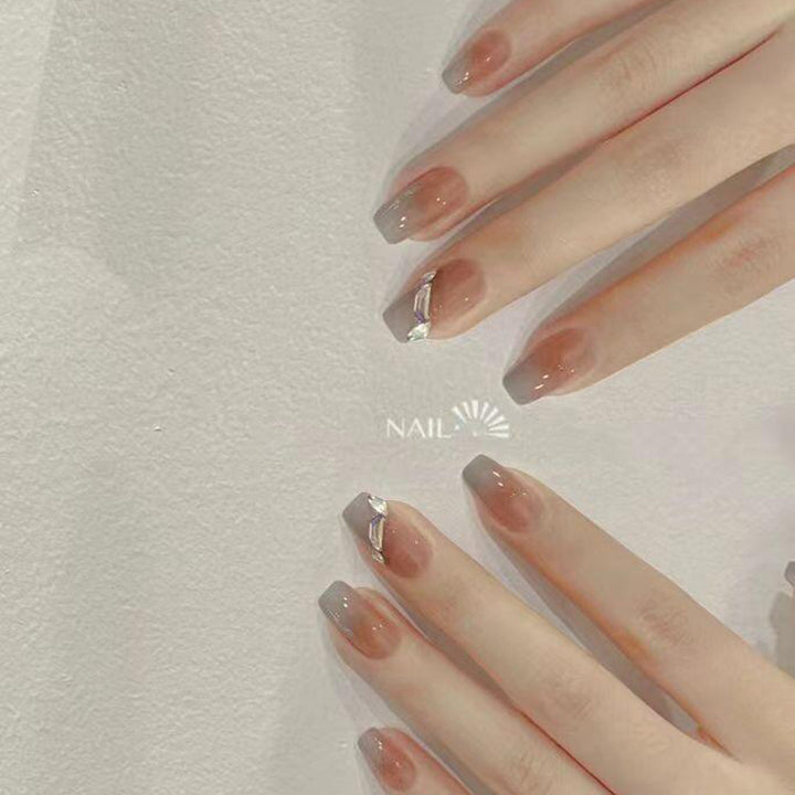 Artificial nail set with elegant ombre design and sparkling applications Kalsten
