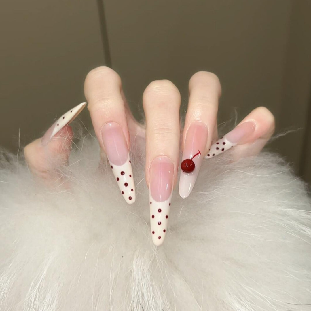 Artificial nails with playful design and cherry accents Kalsten